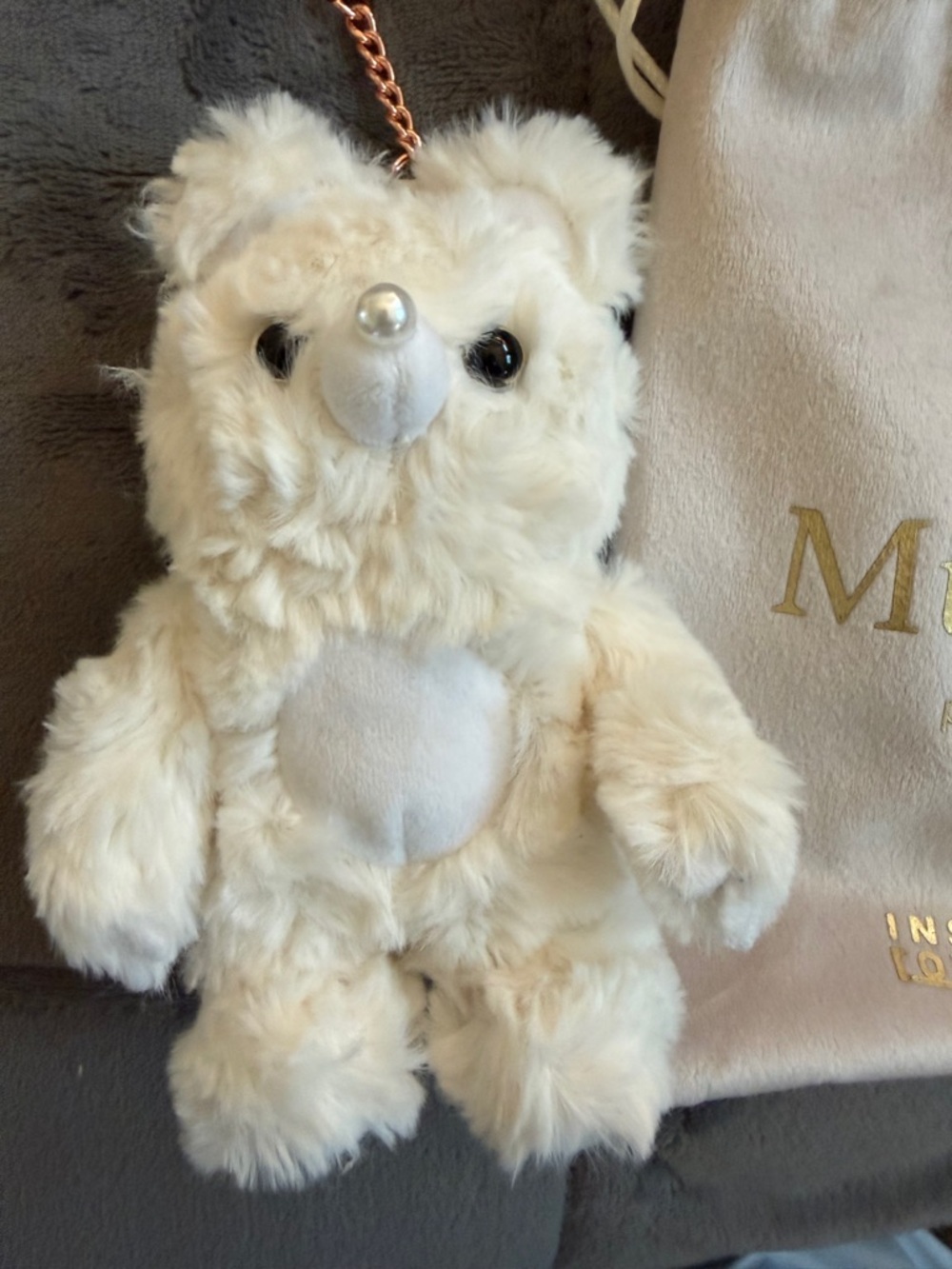 Muckey Plush with velvet Bag cute white plush and trademark eyes 👀 on behind.